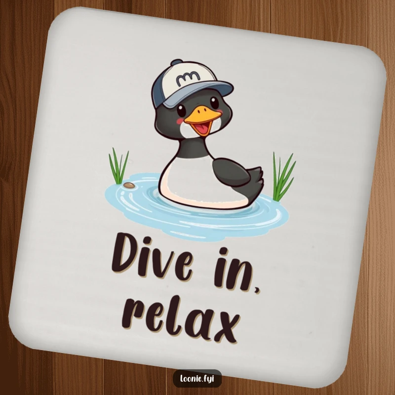 Funny drink coaster with a playful loon in a baseball cap, captured mid-dive into a small lake, adding a humorous touch to any table.