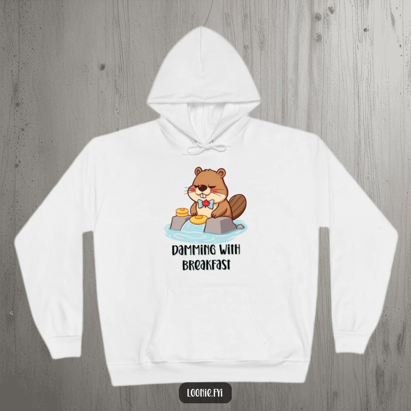 Funny, grumpy beaver wearing a maple leaf bow tie, building a dam with pancakes, printed on a soft, warm hoodie.