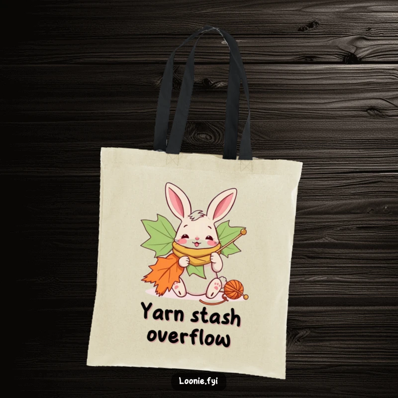 Funny tote bag with a bunny enthusiastically knitting a giant maple leaf scarf, great for crafters.