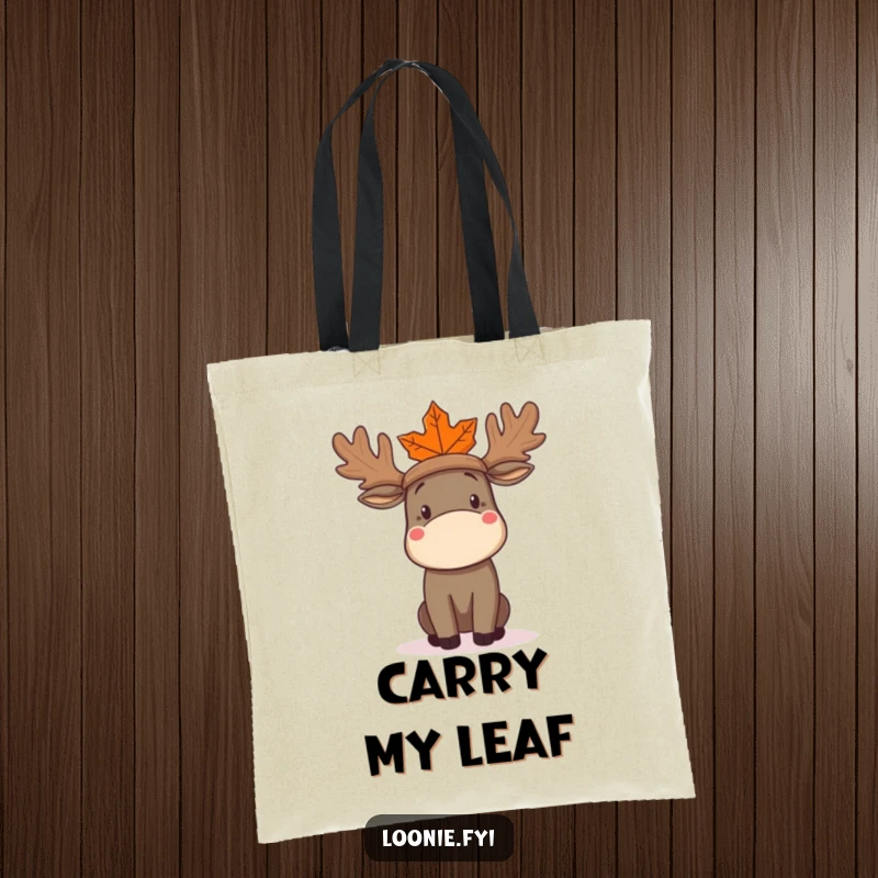 Funny Moose Tote Bag showing a confused moose trying to wear a maple leaf as a hat, practical and amusing for everyday use.